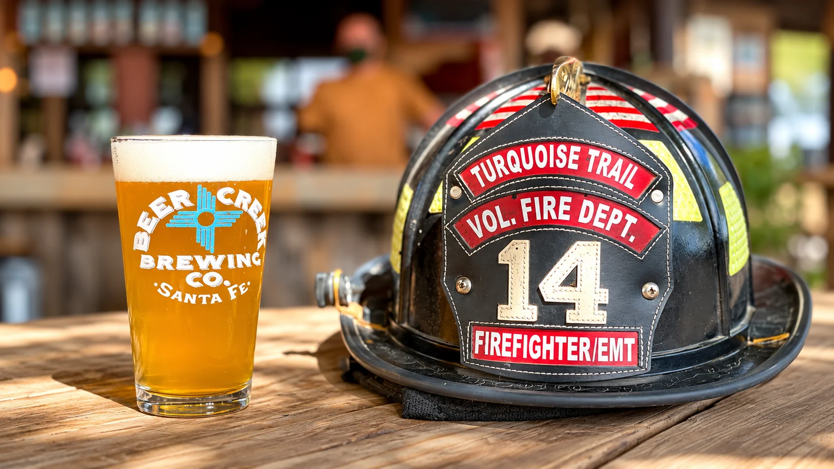 Turquoise Trail Volunteer Fire Department firefighter helmet beside a Beer Creek Brewing Company beer