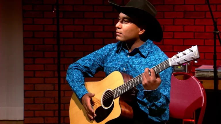 Santana Garcia playing acoustic guitar on KRWG Music Spotlight
